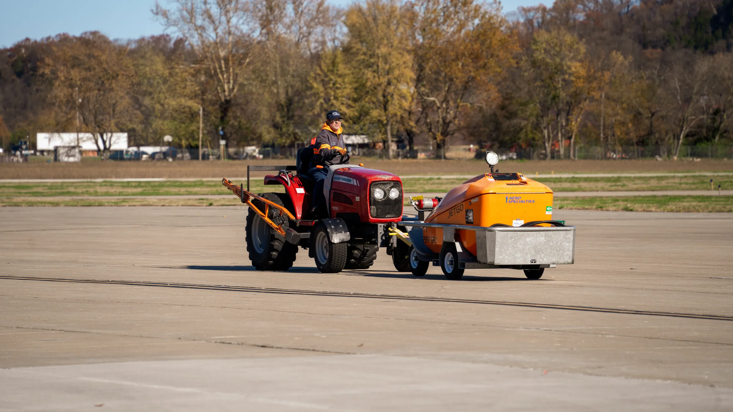 Jefferson City Flying Service line crew towing an aircraft